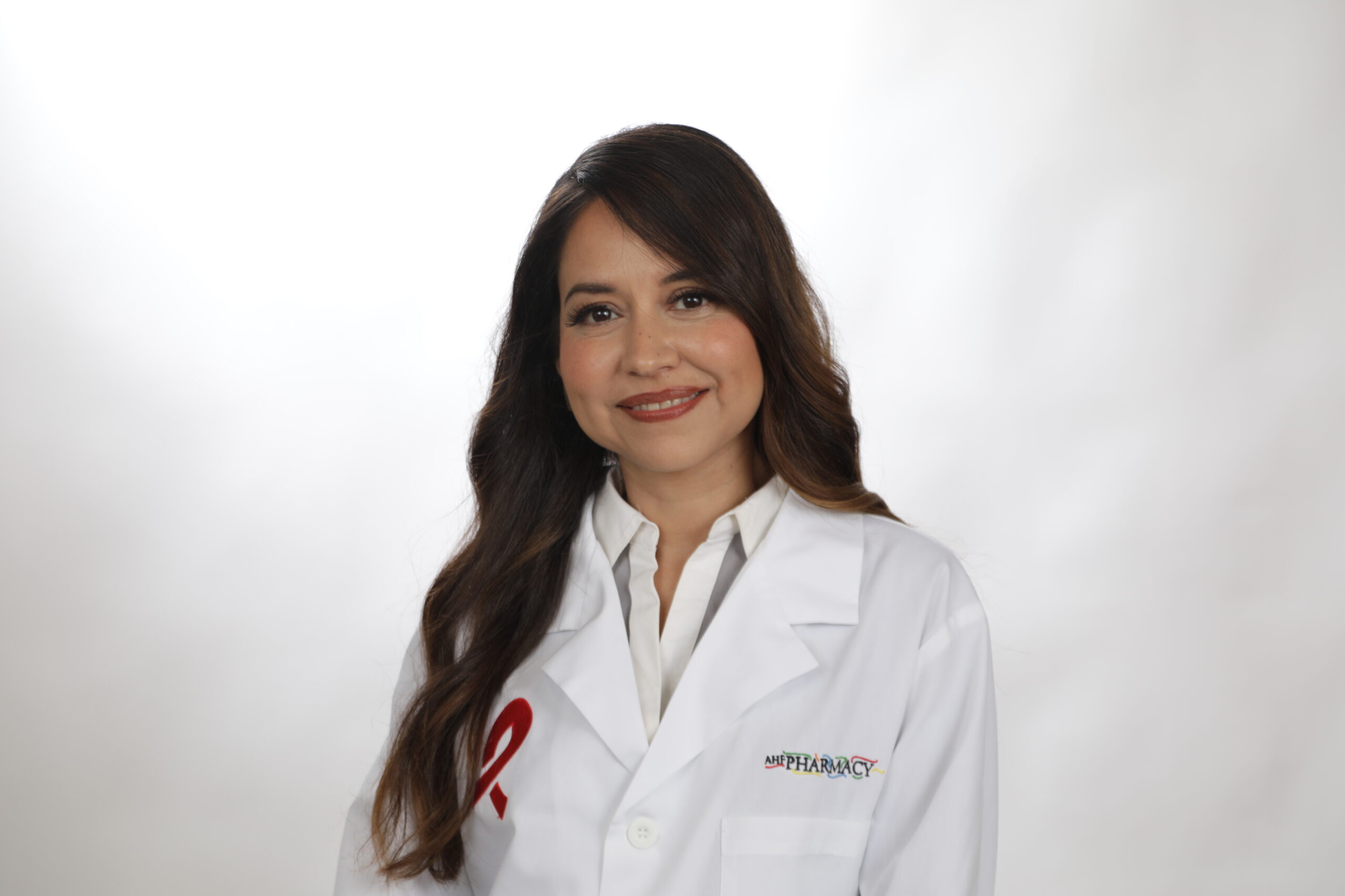 AHF Doctor smiling in front of a white background